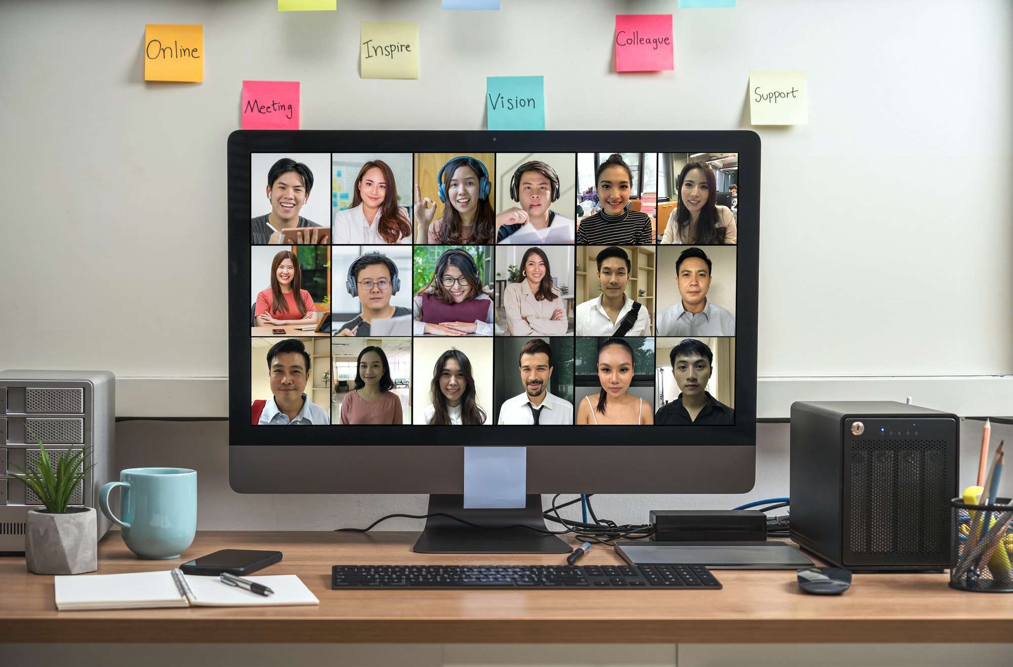 Computer desktop with Stationery and device showing the diversity people with their friend